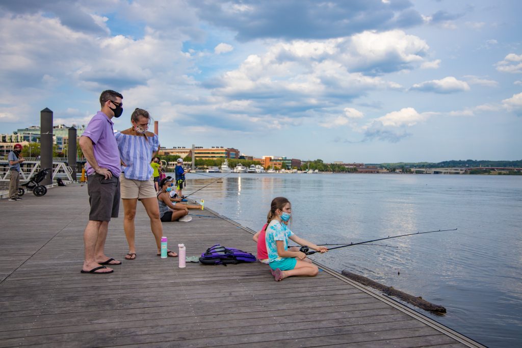 A family on the dock at Friday Night Fishing.
