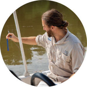 Riverkeeper Trey Sherard measuring pollution on the river.
