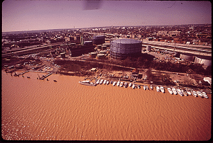 Aerial view of Washington Gas East Staion on the bank of the Anacostia River, which appears brown due to high levels of silt